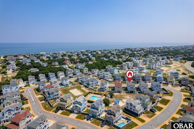 drone / aerial view with a residential view and a water view