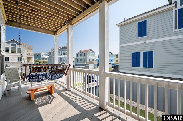 wooden deck featuring a residential view