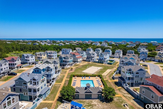 birds eye view of property with a residential view and a water view