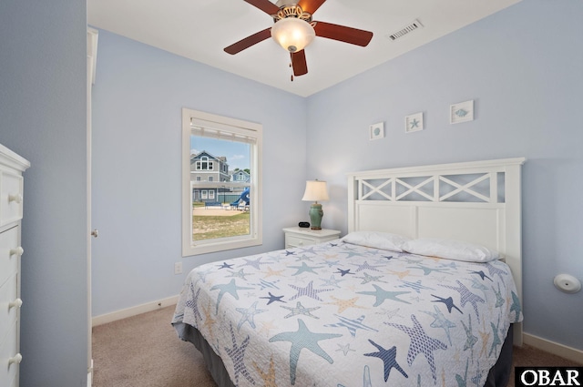 bedroom with a ceiling fan, light carpet, visible vents, and baseboards