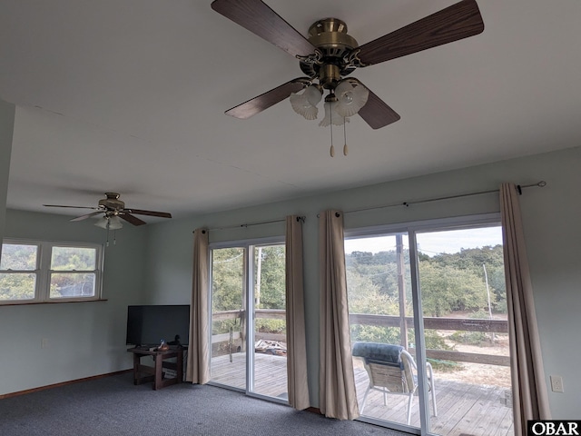 unfurnished living room with carpet floors and baseboards