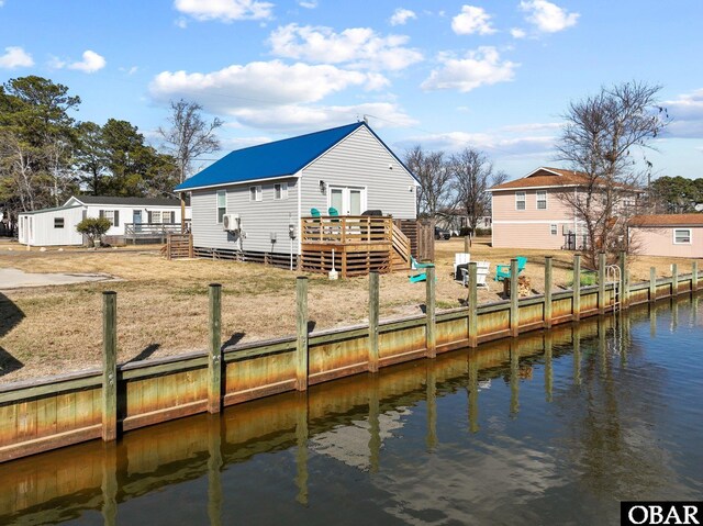 view of dock featuring a deck with water view