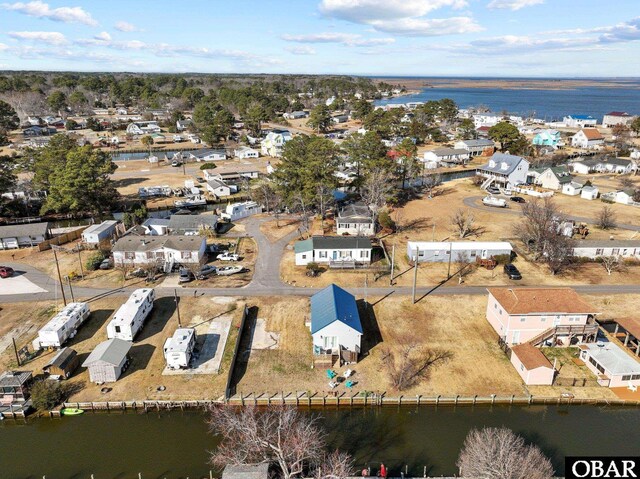 bird's eye view with a water view and a residential view