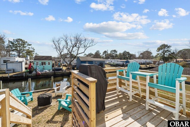 dock area with a water view and a residential view