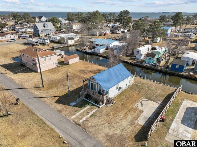 bird's eye view with a water view and a residential view