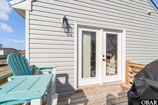 deck with french doors and grilling area