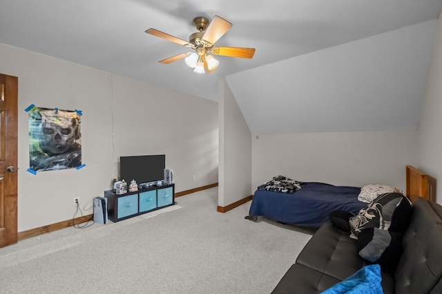 bedroom with baseboards, carpet floors, ceiling fan, and vaulted ceiling