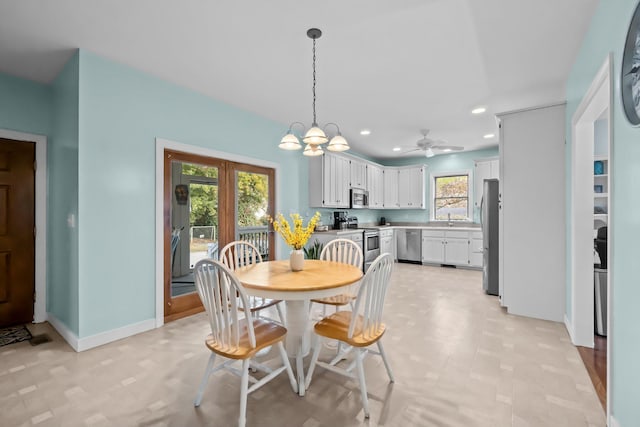 dining space featuring a notable chandelier, recessed lighting, and baseboards