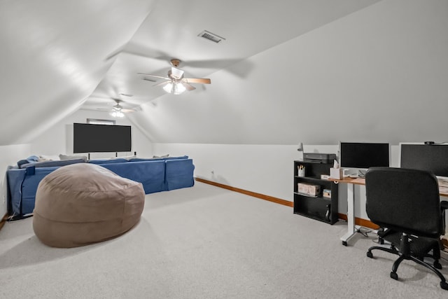 office space featuring visible vents, baseboards, lofted ceiling, and carpet floors