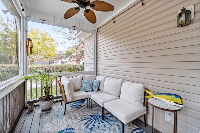 wooden terrace with outdoor lounge area and ceiling fan