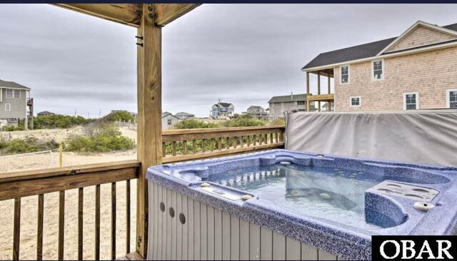 exterior space featuring a hot tub