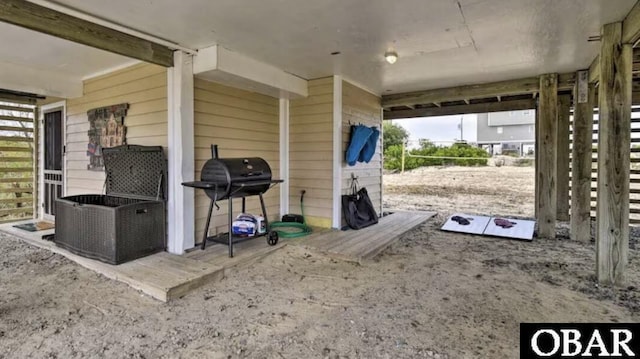 view of patio / terrace with volleyball court and a grill