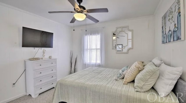 bedroom with ceiling fan, crown molding, and light colored carpet