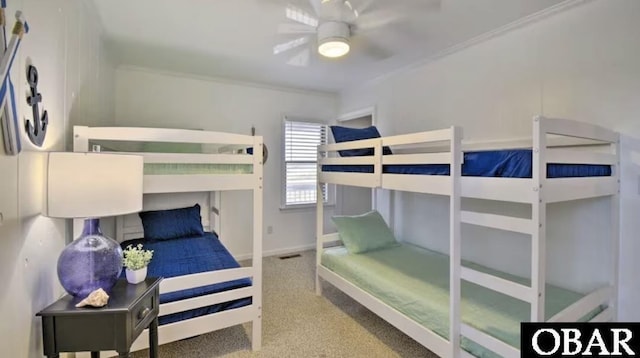 bedroom featuring crown molding and baseboards