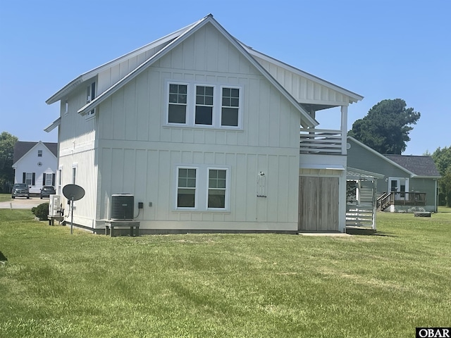102 Daybreak Ct Lot # 53, Grandy, NC 27939 - back of house with board and batten siding and a yard