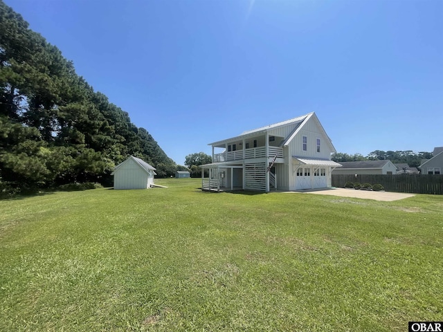 102 Daybreak Ct Lot # 53, Grandy, NC 27939 - back of property featuring a garage, a storage unit, and concrete driveway