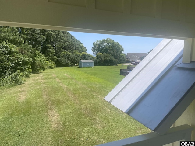 102 Daybreak Ct Lot # 53, Grandy, NC 27939 - view of grassy yard with a storage shed