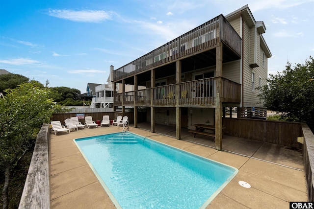 629 Sanderling Trl Lot 51, Corolla, NC 27927 - back of property featuring a patio area, outdoor lounge area, and a balcony