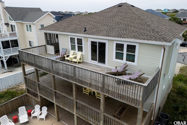 629 Sanderling Trl Lot 51, Corolla, NC 27927 - back of property with a shingled roof and a deck