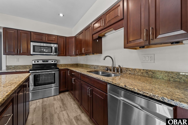 1095 Burnside Rd Lot B3, Manteo, NC 27954 - kitchen featuring stainless steel appliances, a sink, light stone countertops, light wood-type flooring, and recessed lighting