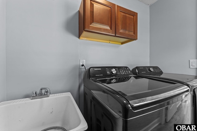 1095 Burnside Rd Lot B3, Manteo, NC 27954 - laundry area with cabinet space and separate washer and dryer