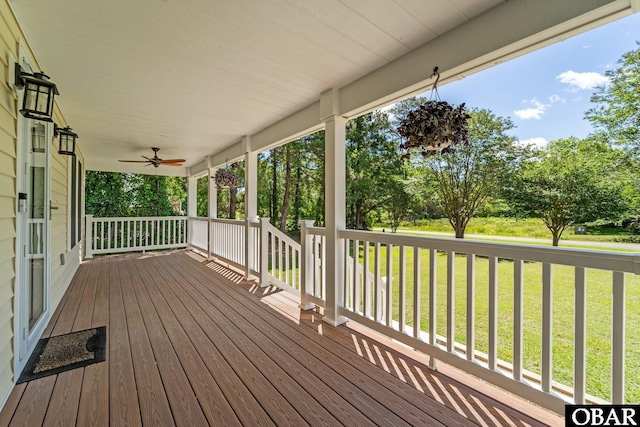 1095 Burnside Rd Lot B3, Manteo, NC 27954 - wooden porch featuring a yard and ceiling fan