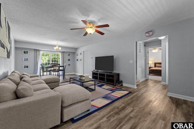1095 Burnside Rd Lot B3, Manteo, NC 27954 - living room with a ceiling fan, a textured ceiling, a chandelier, wood finished floors, and baseboards