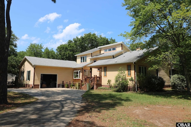 509 Telegraph Ct Lot 17, Kill Devil Hills, NC 27948 - view of front facade with a garage, asphalt driveway, and roof with shingles