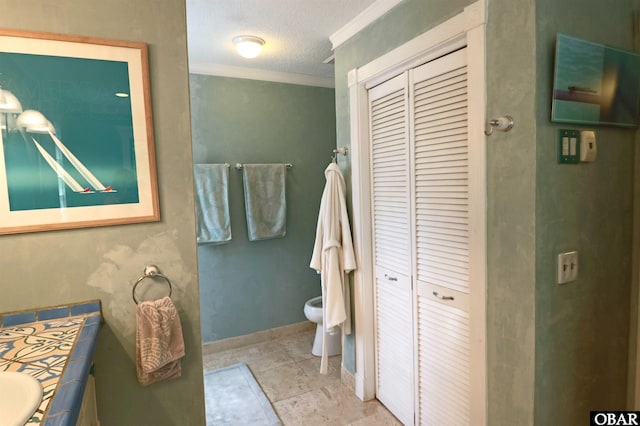 509 Telegraph Ct Lot 17, Kill Devil Hills, NC 27948 - bathroom featuring a closet, toilet, crown molding, vanity, and a textured ceiling
