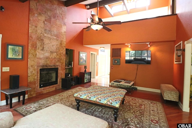 509 Telegraph Ct Lot 17, Kill Devil Hills, NC 27948 - living area featuring high vaulted ceiling, a ceiling fan, wood finished floors, a tile fireplace, and baseboards