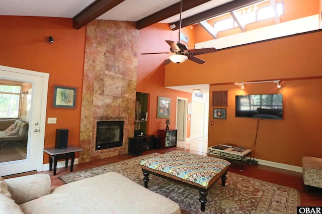 509 Telegraph Ct Lot 17, Kill Devil Hills, NC 27948 - living room with ceiling fan, baseboards, wood finished floors, beamed ceiling, and a tile fireplace