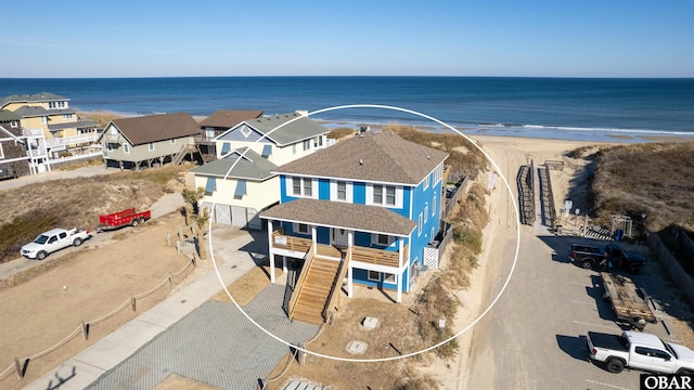 aerial view with a beach view and a water view