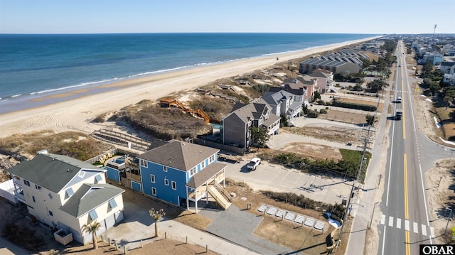 bird's eye view featuring a water view, a residential view, and a view of the beach