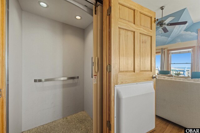 bathroom featuring lofted ceiling, a ceiling fan, and recessed lighting