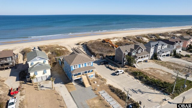 bird's eye view with a beach view, a residential view, and a water view