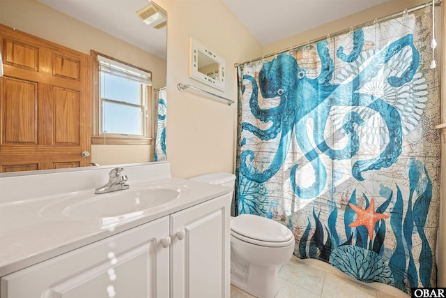 bathroom featuring toilet, visible vents, vanity, and tile patterned floors