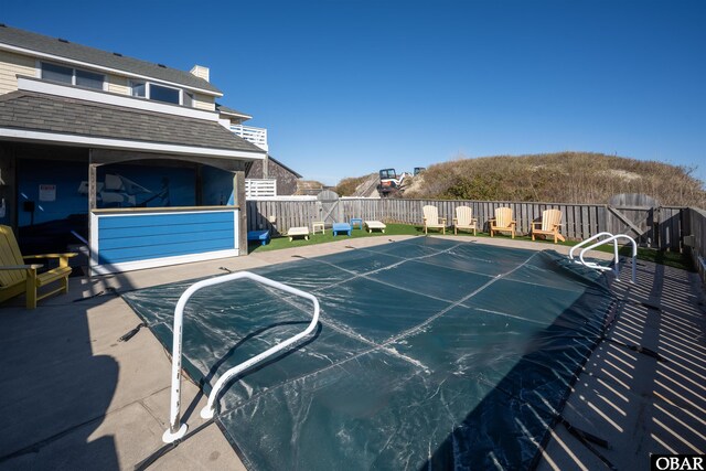 view of pool with fence, a fenced in pool, and a patio