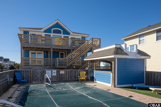 exterior space featuring fence and a balcony