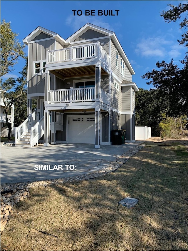 rear view of house with board and batten siding, driveway, a balcony, and an attached garage