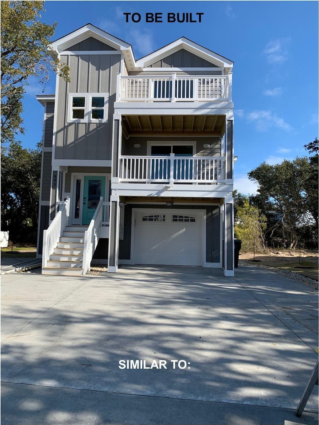 view of front of house featuring a balcony, an attached garage, board and batten siding, and concrete driveway