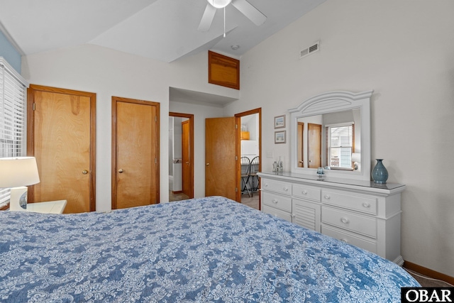 bedroom with baseboards, visible vents, ceiling fan, vaulted ceiling, and multiple closets