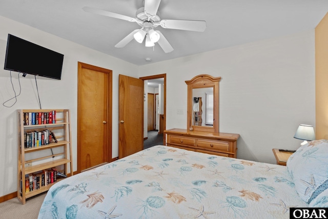 bedroom featuring baseboards, a ceiling fan, and light colored carpet