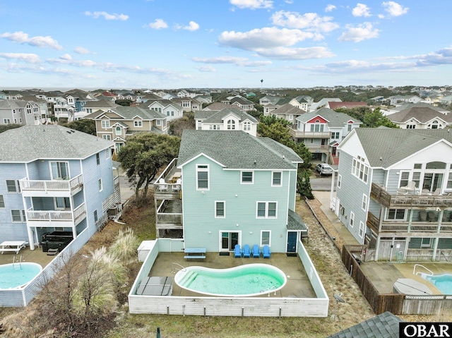 birds eye view of property with a residential view