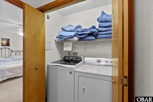 clothes washing area featuring carpet, laundry area, ceiling fan, and separate washer and dryer