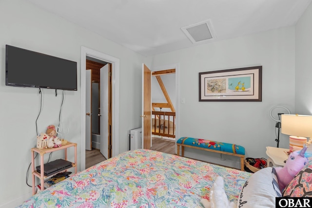 100 Tides Dr Lot 1, Duck, NC 27949 - bedroom featuring wood finished floors, attic access, and baseboards