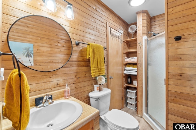 100 Tides Dr Lot 1, Duck, NC 27949 - bathroom with wood walls, a stall shower, vanity, toilet, and wood finished floors