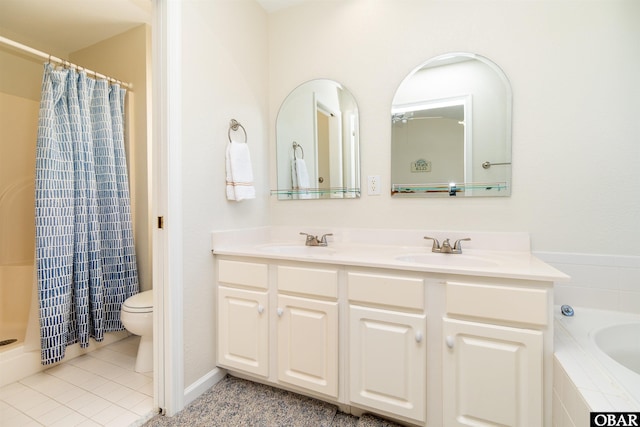 bathroom featuring double vanity, a sink, toilet, and tile patterned floors