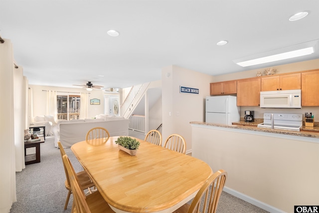 dining room with recessed lighting, light colored carpet, ceiling fan, and baseboards