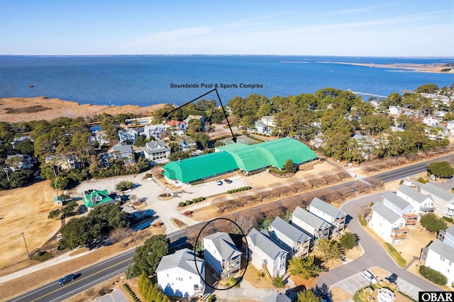 bird's eye view featuring a water view and a residential view