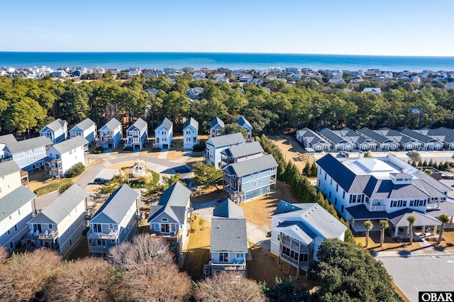 drone / aerial view with a water view and a residential view